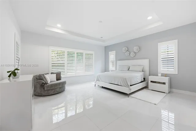 a bedroom with a bed and a couch