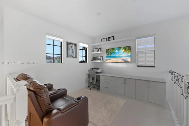 a living room with furniture and a window