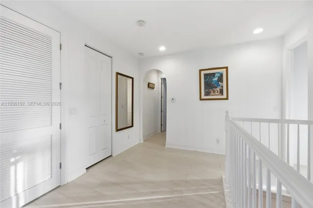 a view of a hallway with an entryway