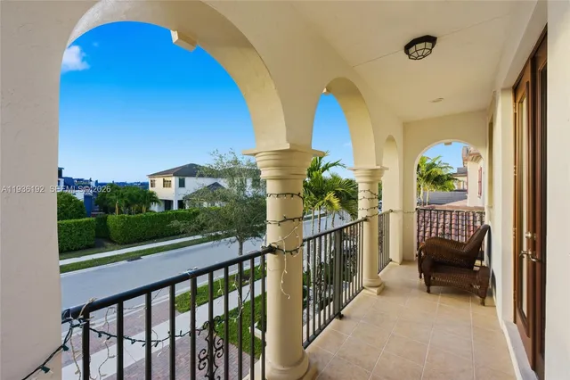 a view of balcony with two chairs and a table