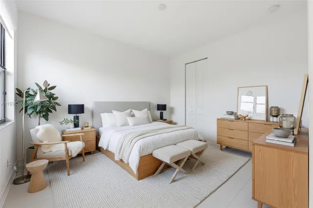 a bedroom with a bed and a couch