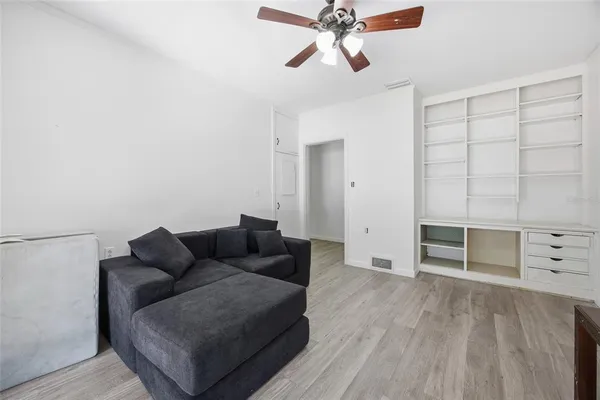 a view of a room with furniture window and wooden floor