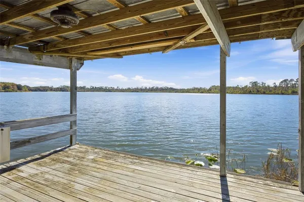 view of a house with a yard and garden