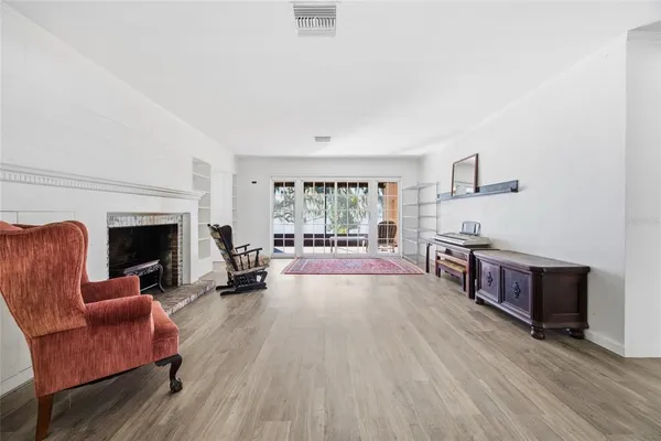 a kitchen with a table chairs and cabinets