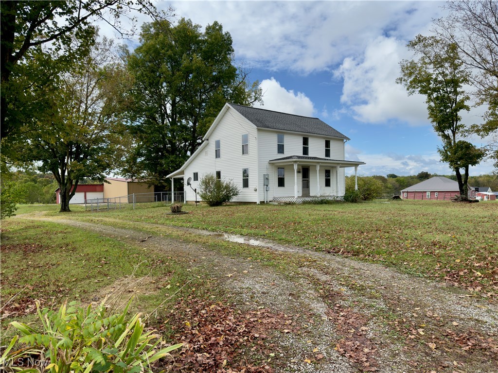 2109 Bell Road Vincent, OH 45784 - Photo 2 of 49 View of front of house with a porch and a garage