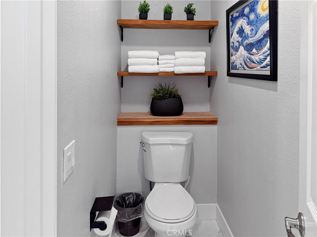 16955 Lake Knoll Parkway Riverside, CA 92503 - Photo 30 of 42 a bathroom with a toilet a sink and vanity
