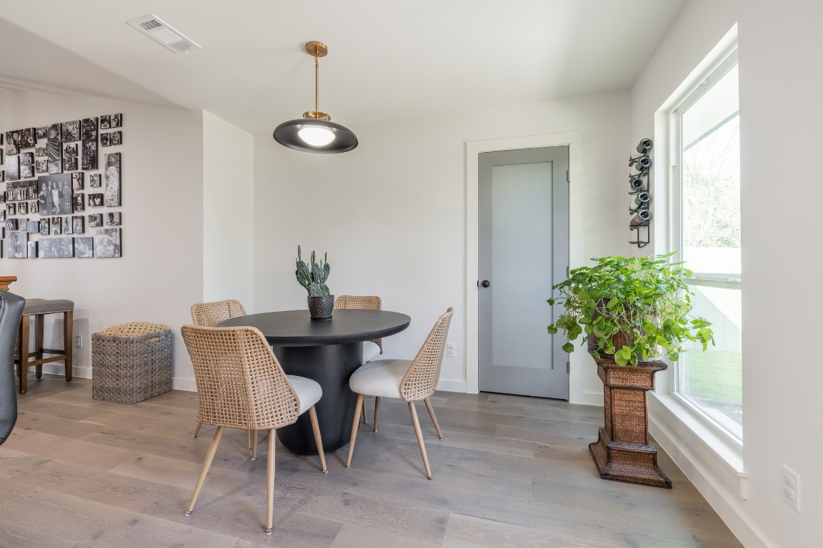 2214 Lear Lane Austin, TX 78745 - Photo 15 of 40 a dining room with furniture and potted plant