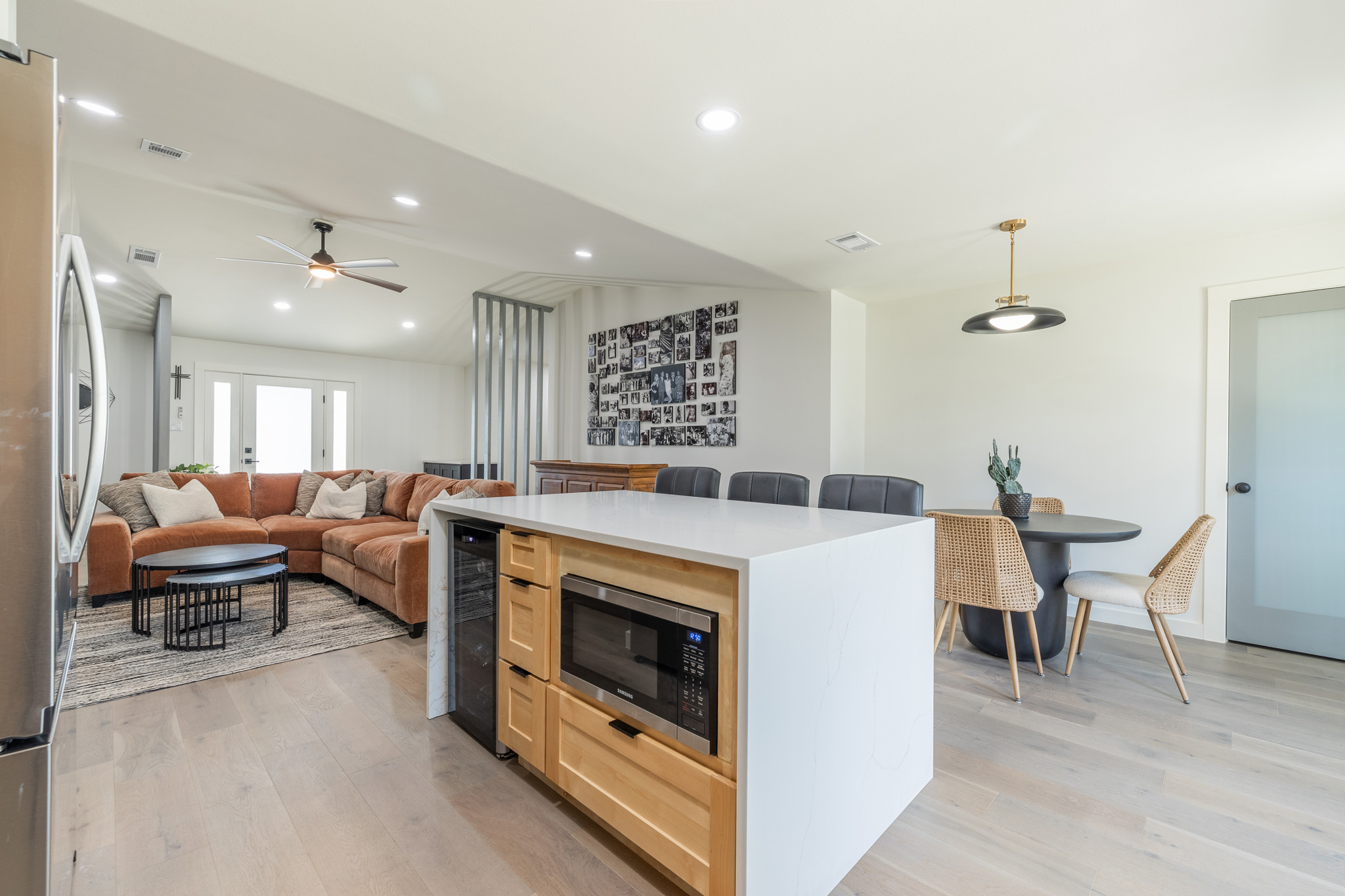 2214 Lear Lane Austin, TX 78745 - Photo 19 of 40 a living room with furniture a fireplace and kitchen view