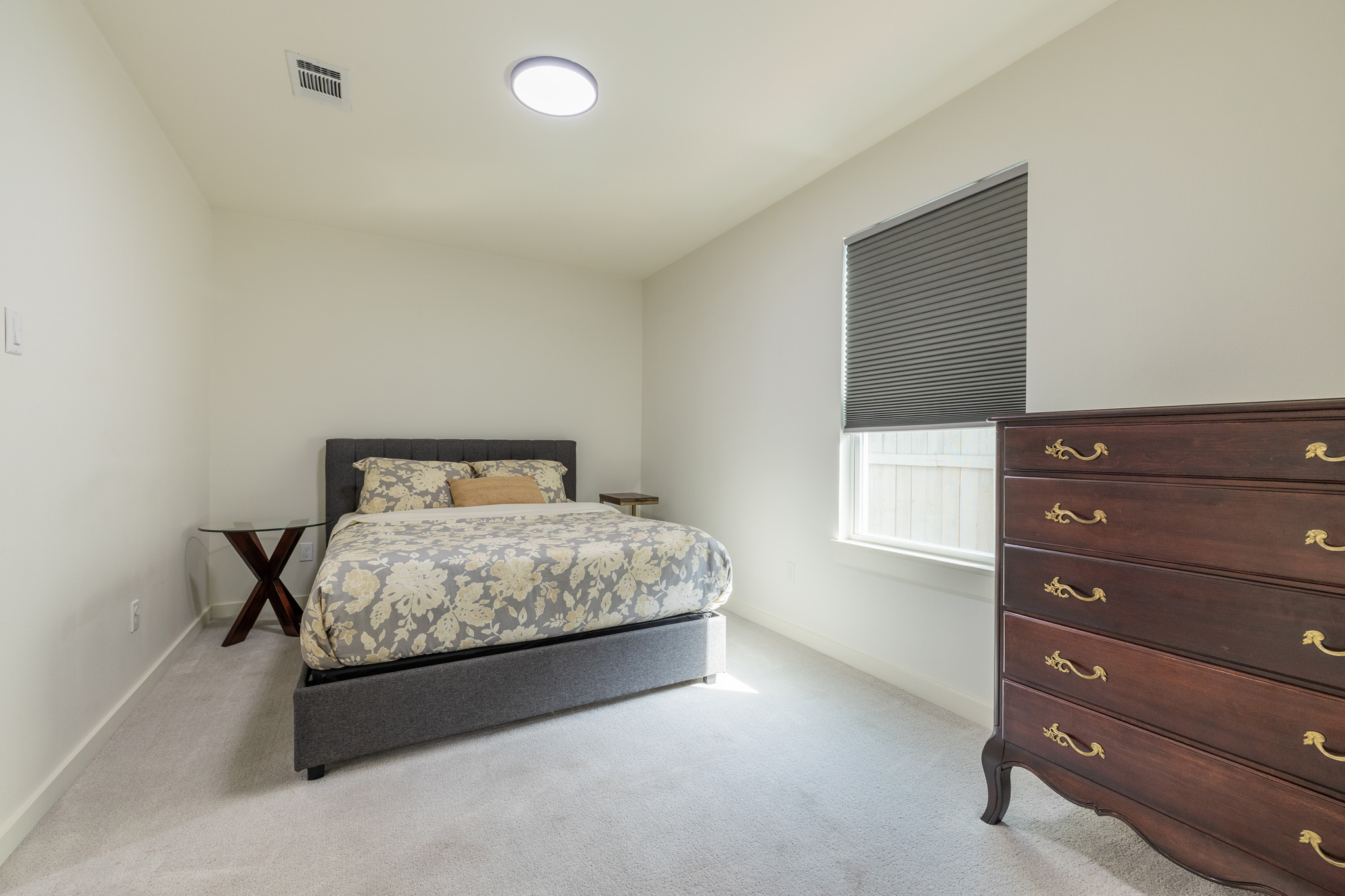 2214 Lear Lane Austin, TX 78745 - Photo 24 of 40 a bedroom with a bed and window