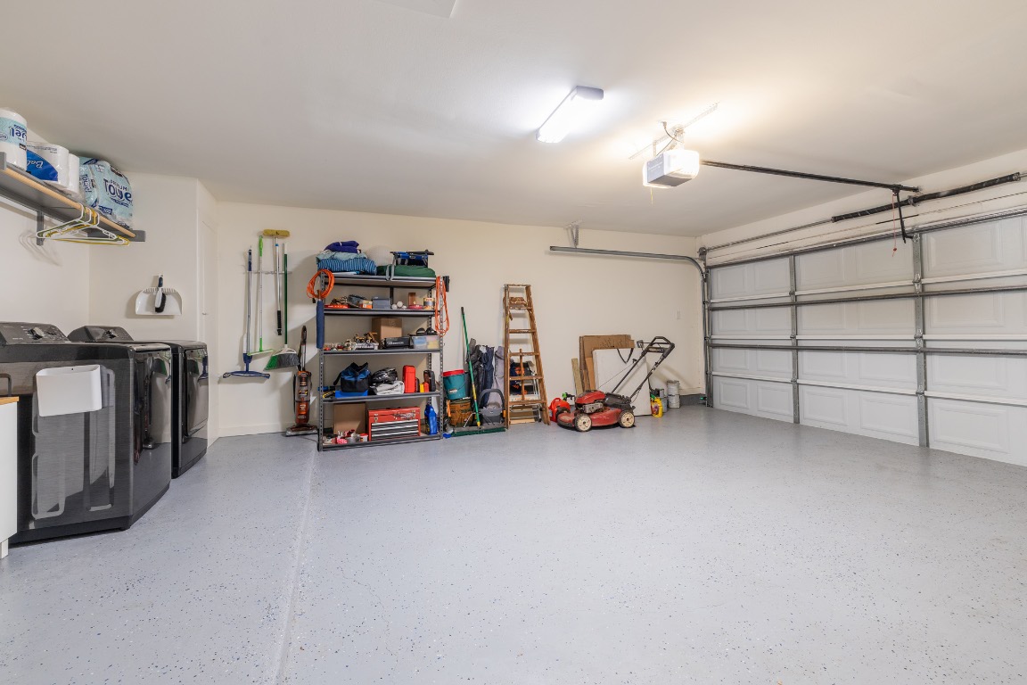2214 Lear Lane Austin, TX 78745 - Photo 36 of 40 a view of a garage with parked cars