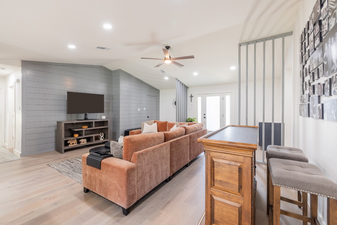 2214 Lear Lane Austin, TX 78745 - Photo 9 of 40 a living room with furniture and a flat screen tv