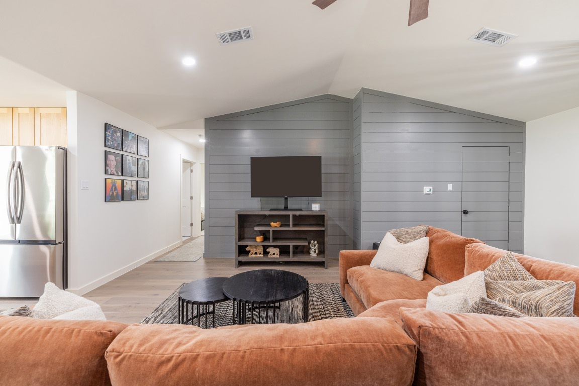 2214 Lear Lane Austin, TX 78745 - Photo 10 of 40 a living room with furniture and a flat screen tv