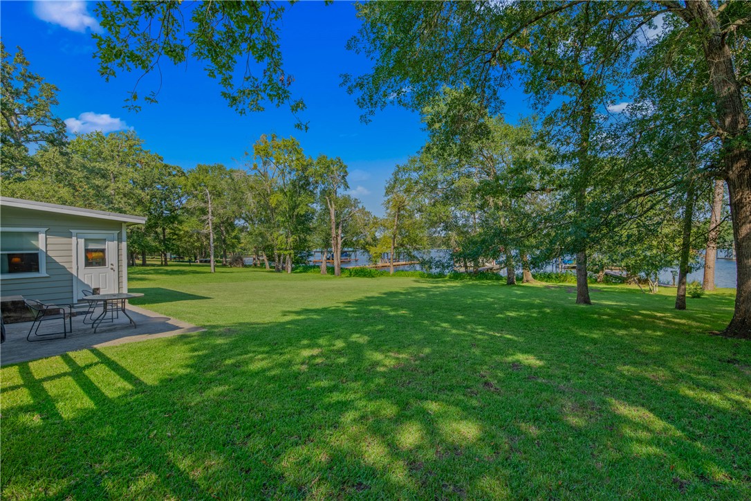 11001 Clyde Acord Road Franklin, TX 77856 - Photo 25 of 43 a view of a house with a yard