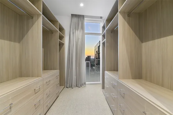 a spacious bathroom with a bathtub and a sink