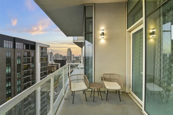 an outdoor patio with table and chairs