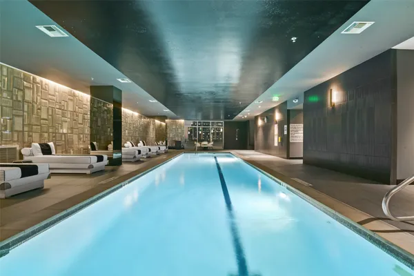 a view of swimming pool with outdoor seating