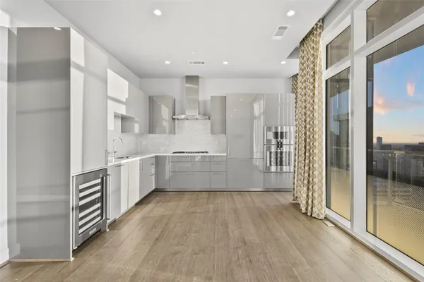 a kitchen with a sink and cabinets