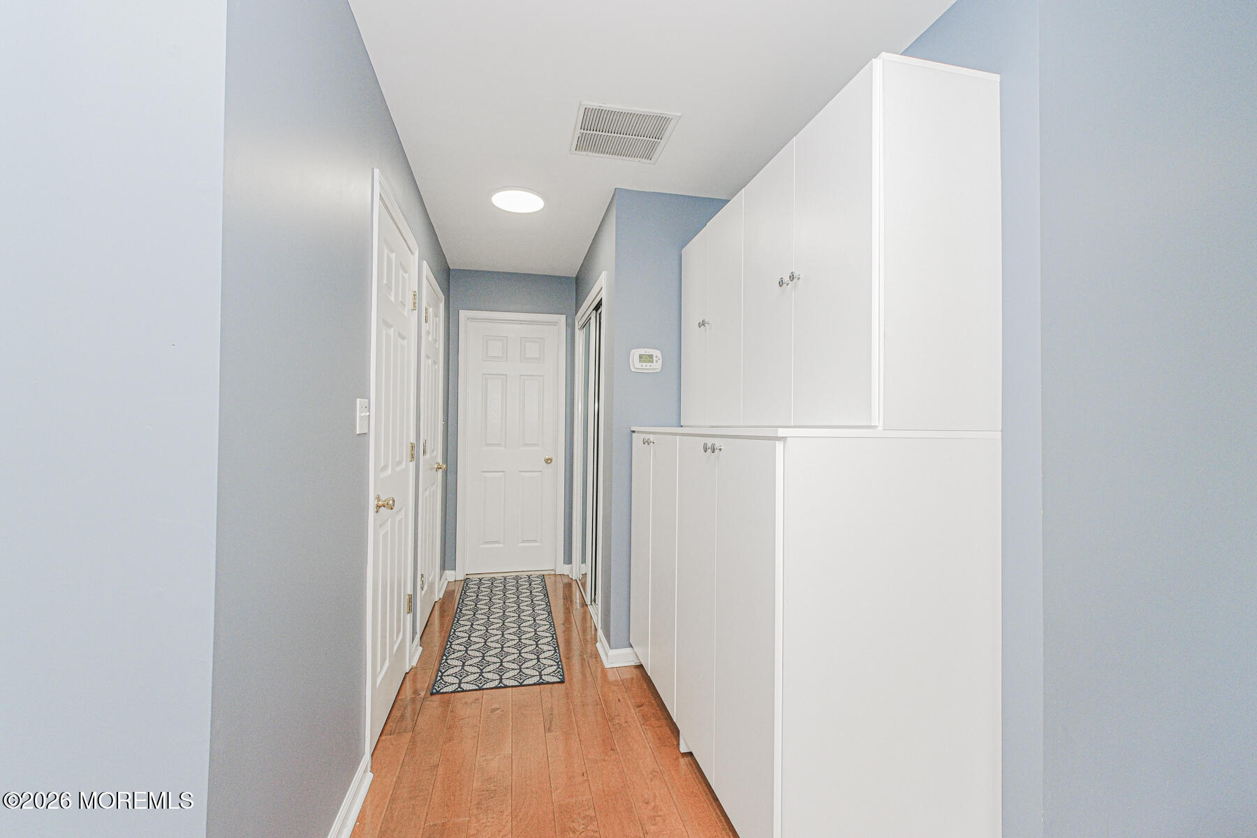 315 Wedgewood Road Morganville, NJ 07751 - Photo 31 of 37 a view of hallway with stainless steel appliances
