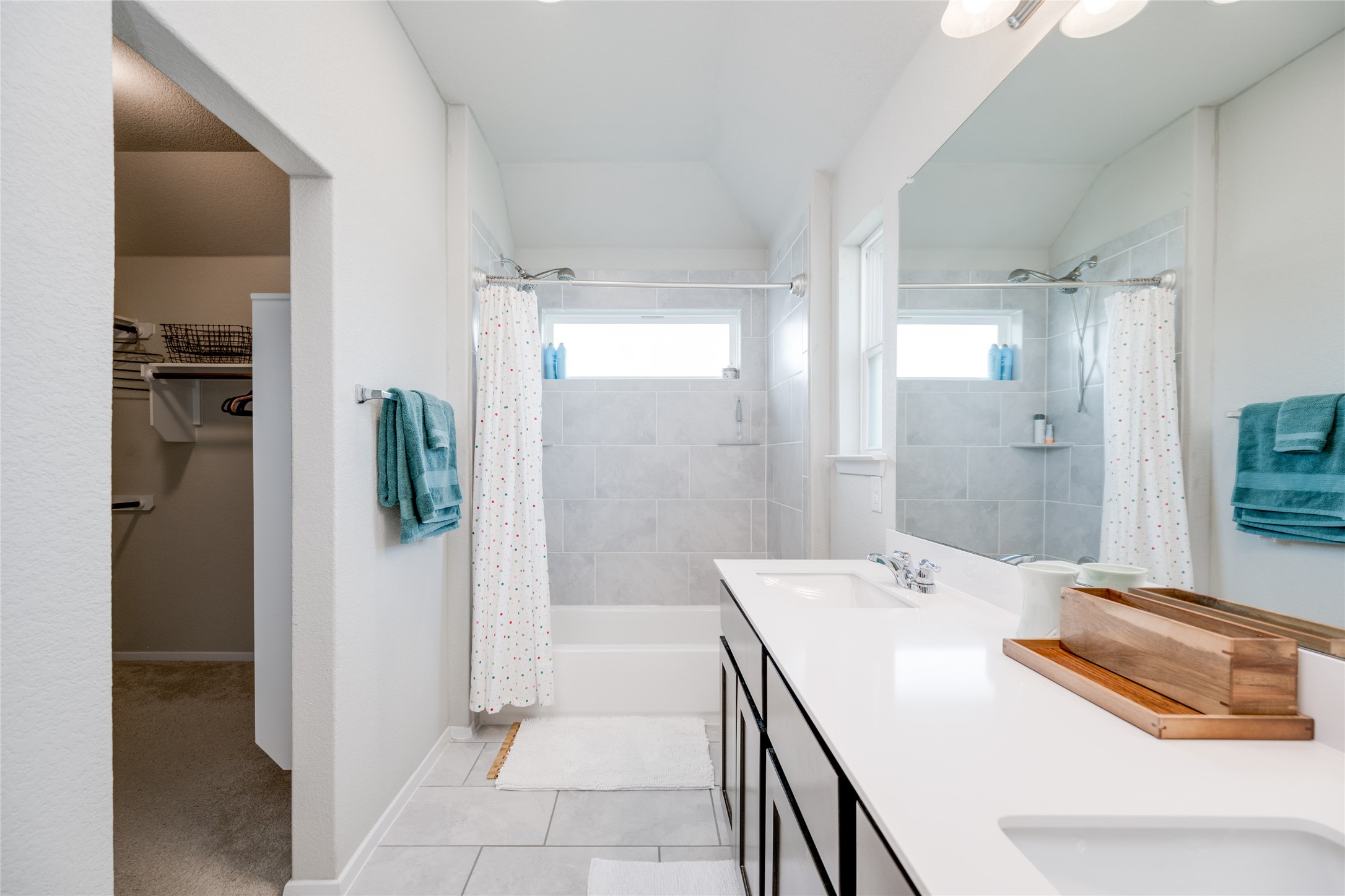 7948 Castelardo Place Round Rock, TX 78665 - Photo 22 of 32 a bathroom with a tub sink and mirror