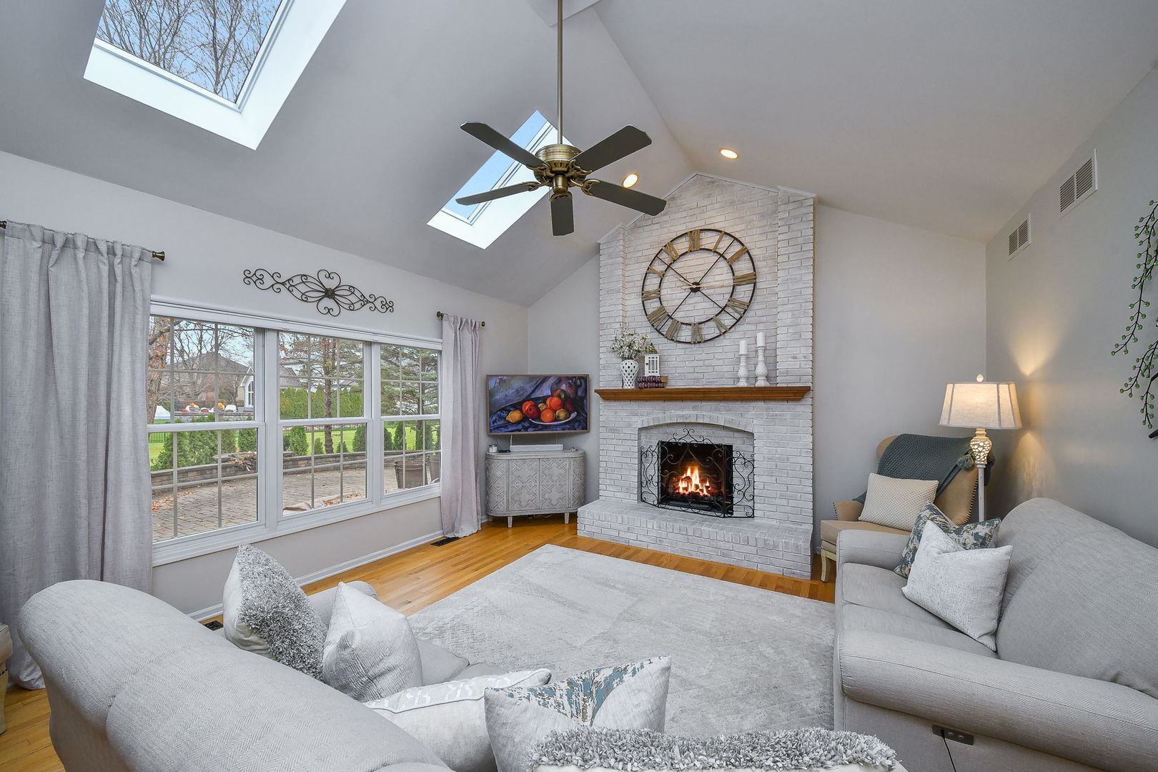 4N403 South Robert Frost Circle St. Charles, IL 60175 - Photo 12 of 29 a living room with furniture a fireplace and a large window