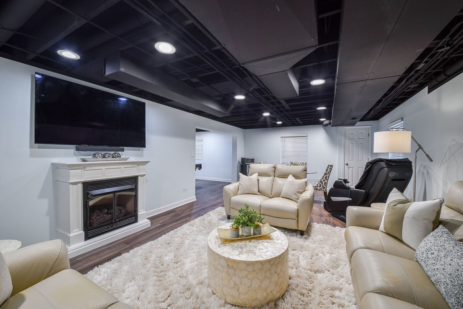 4N403 South Robert Frost Circle St. Charles, IL 60175 - Photo 23 of 29 a living room with furniture a fireplace and a flat screen tv
