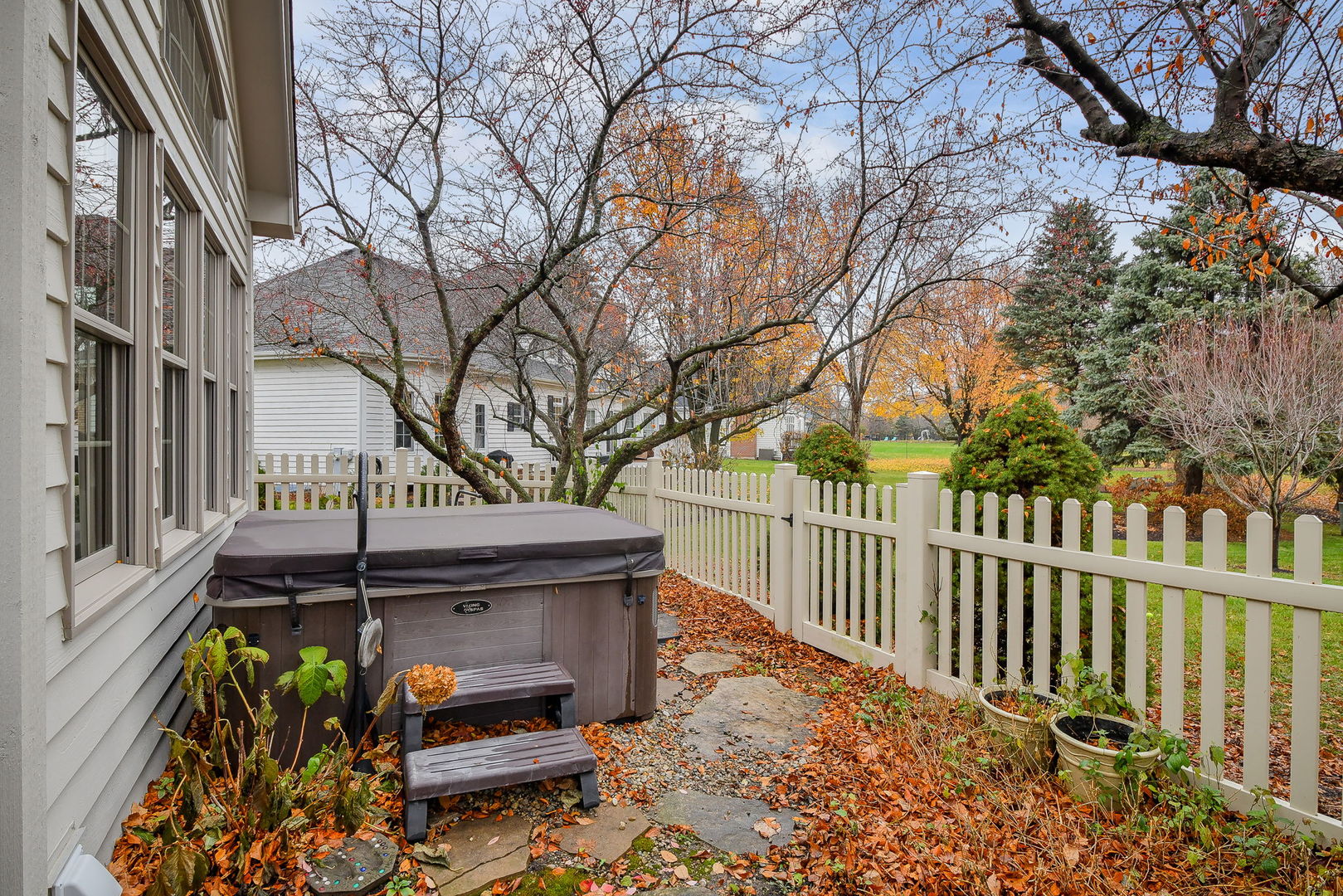 4N403 South Robert Frost Circle St. Charles, IL 60175 - Photo 28 of 29 a wooden bench sitting in front of a house