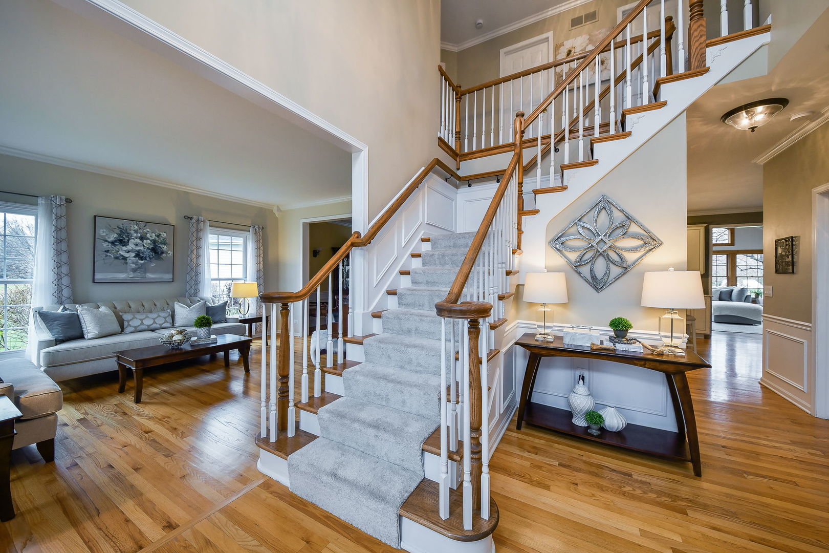 4N403 South Robert Frost Circle St. Charles, IL 60175 - Photo 3 of 29 a living room with wooden floor and stairs