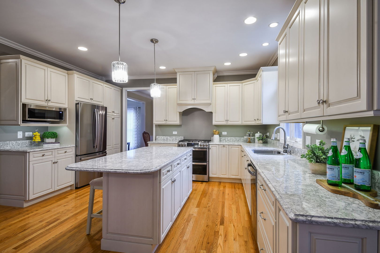 4N403 South Robert Frost Circle St. Charles, IL 60175 - Photo 9 of 29 a kitchen with stainless steel appliances granite countertop wooden cabinets a sink dishwasher a stove and a refrigerator