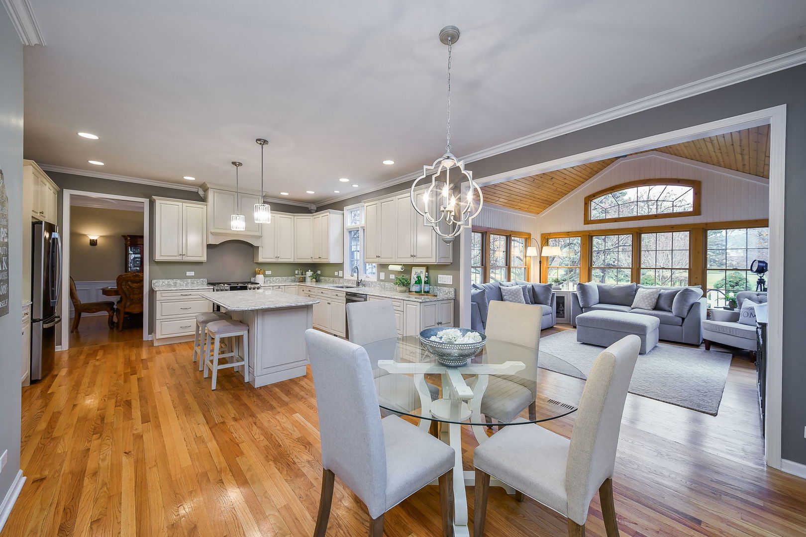 4N403 South Robert Frost Circle St. Charles, IL 60175 - Photo 10 of 29 a view of a dining room and livingroom with furniture wooden floor a chandelier