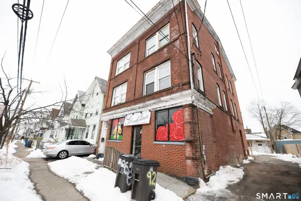 a view of a building with a yard