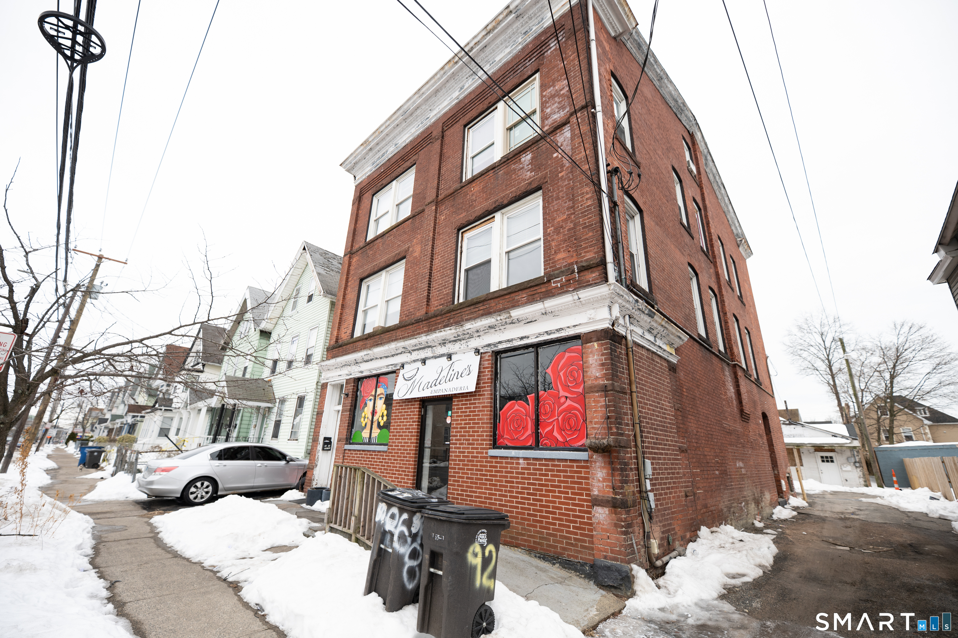 a view of a building with a yard