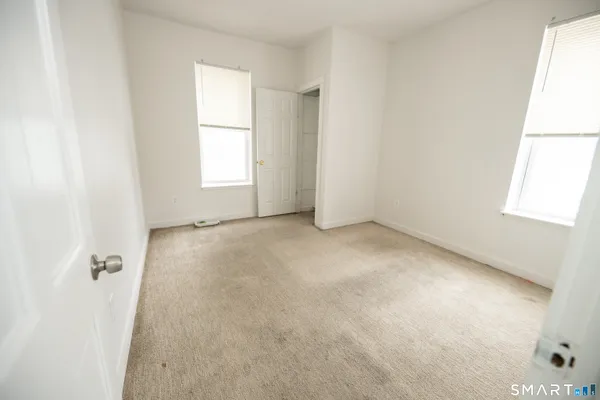an empty room with windows