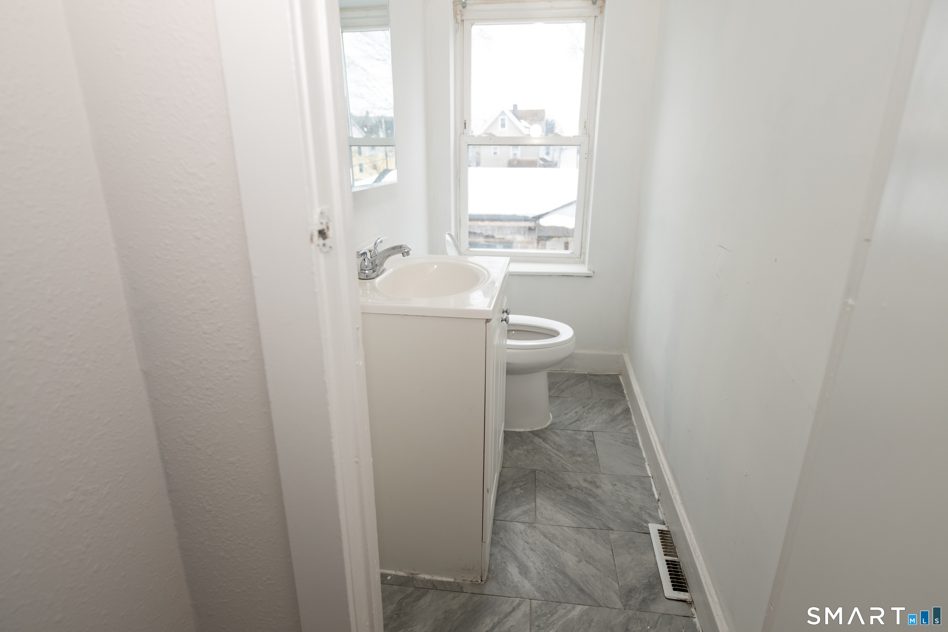 86 Spring Street, Unit 2 West Haven, CT 06516 - Photo 6 of 27 a bathroom with a toilet