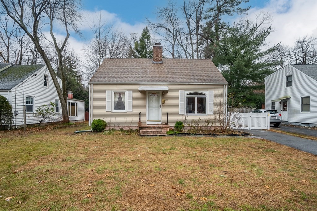 a house that has a tree in front of it