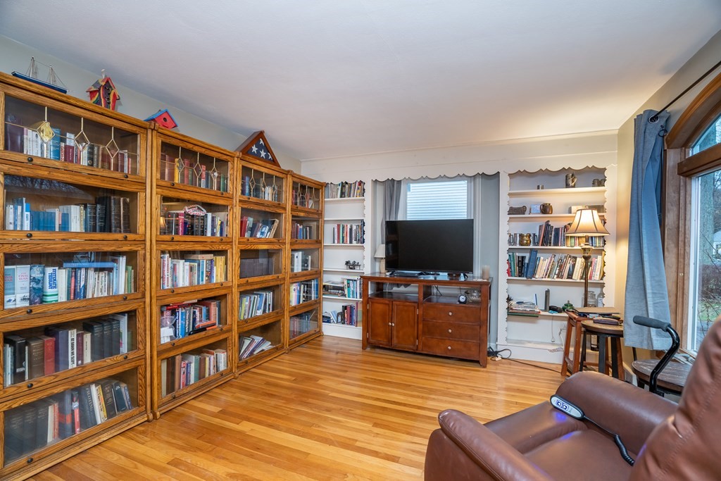 107 Mayflower Road Springfield, MA 01118 - Photo 11 of 32 a living room with furniture and a flat screen tv