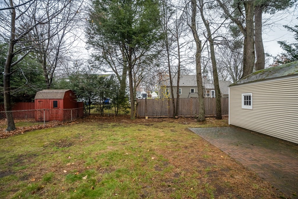 107 Mayflower Road Springfield, MA 01118 - Photo 5 of 32 a backyard of a house with fountain and trees