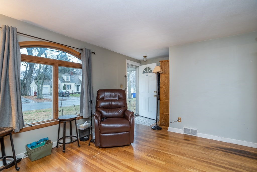107 Mayflower Road Springfield, MA 01118 - Photo 9 of 32 a living room with furniture and two windows