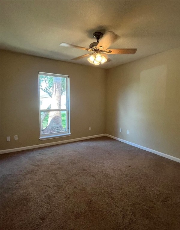 4621 Valor Drive Corpus Christi, TX 78413 - Photo 11 of 13 an empty room with windows and fan