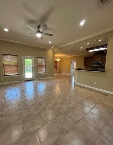 a view of an empty room and a window