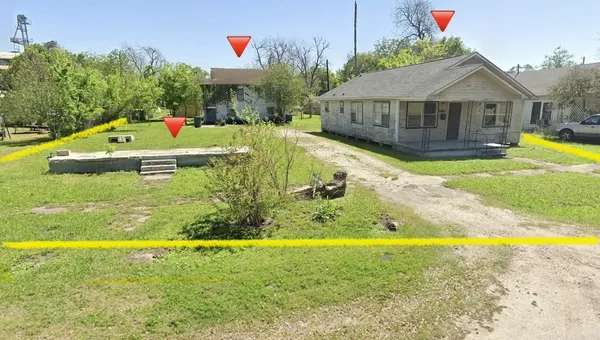 a view of a house with swimming pool and a yard
