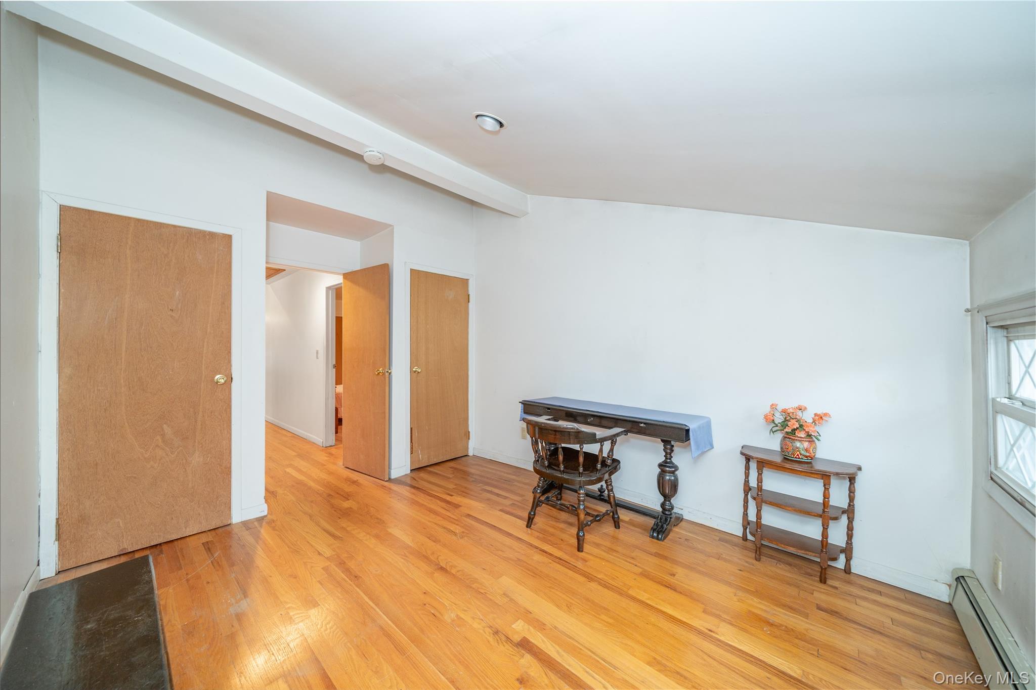 1259 Post Road Scarsdale, NY 10583 - Photo 17 of 20 a view of a livingroom with wooden floor and a bookshelf