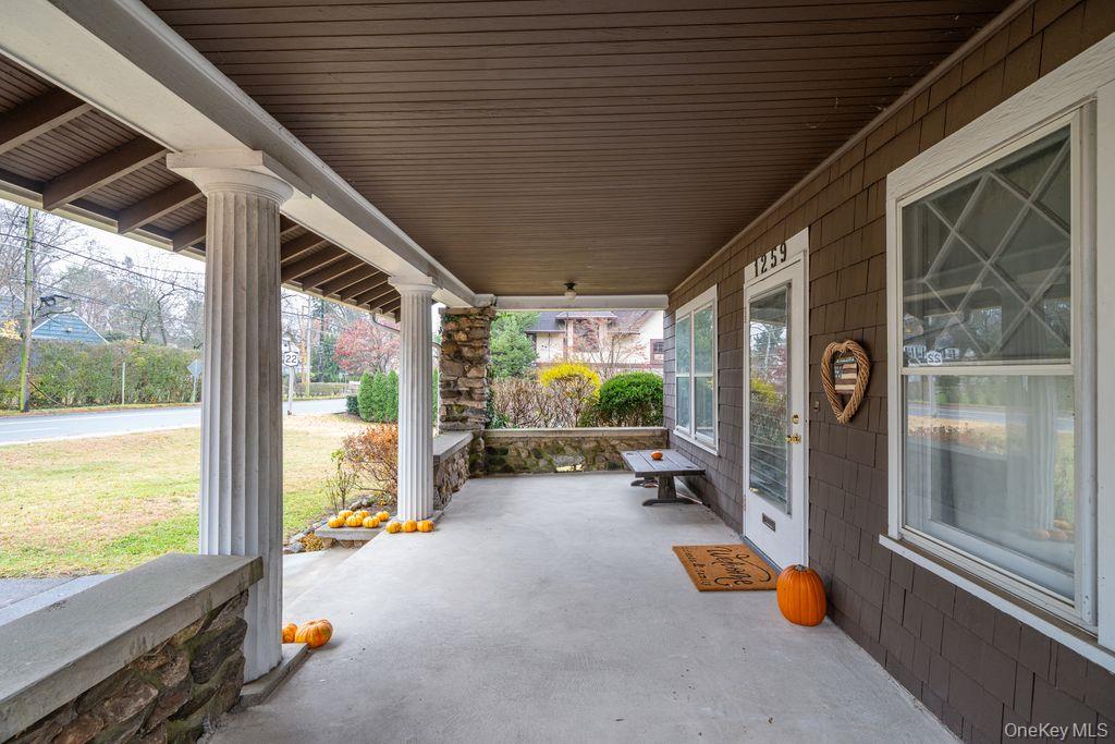 1259 Post Road Scarsdale, NY 10583 - Photo 2 of 20 a view of a porch with chairs and floor to ceiling window