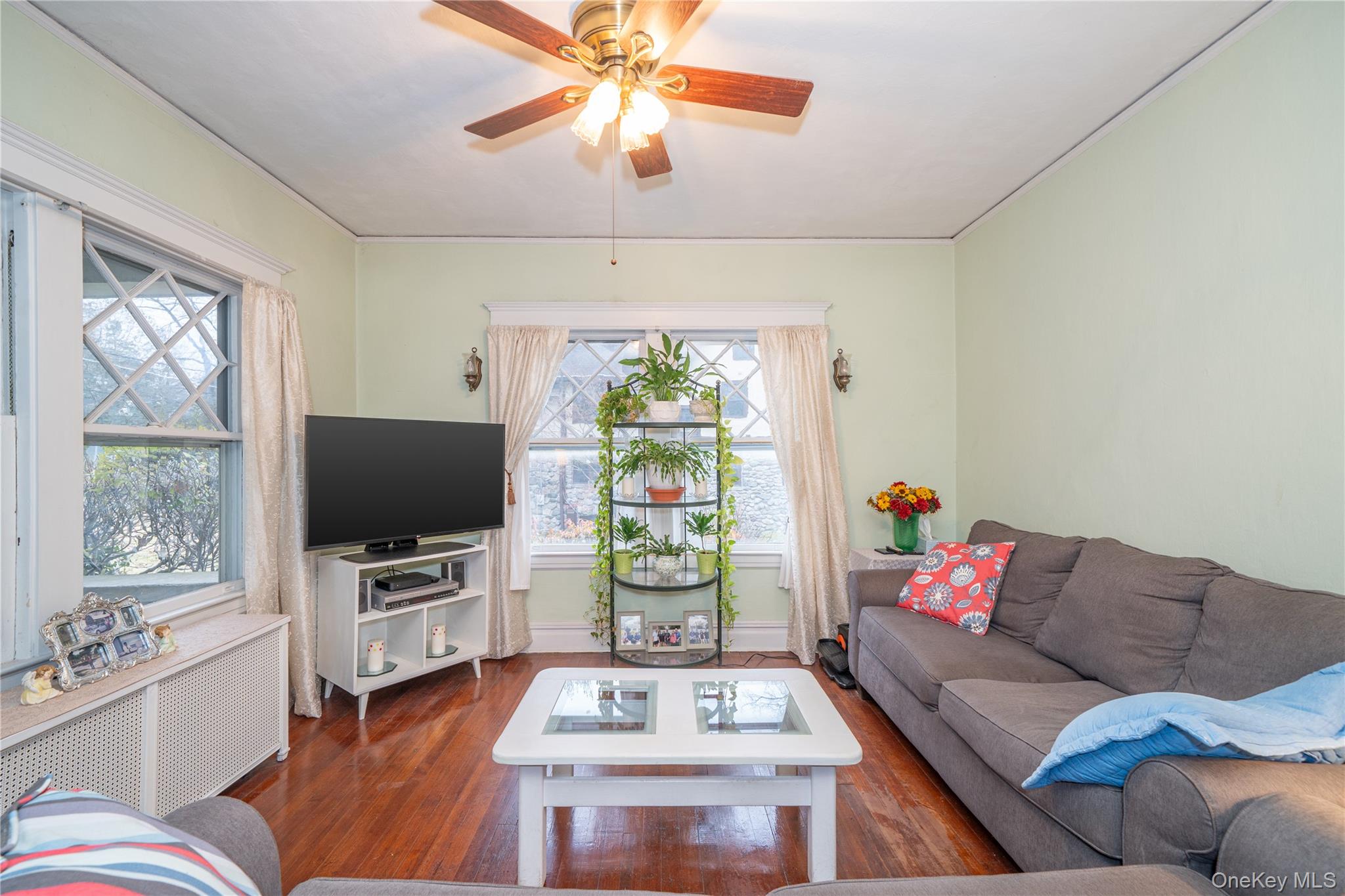 1259 Post Road Scarsdale, NY 10583 - Photo 9 of 20 a living room with furniture a window and a flat screen tv
