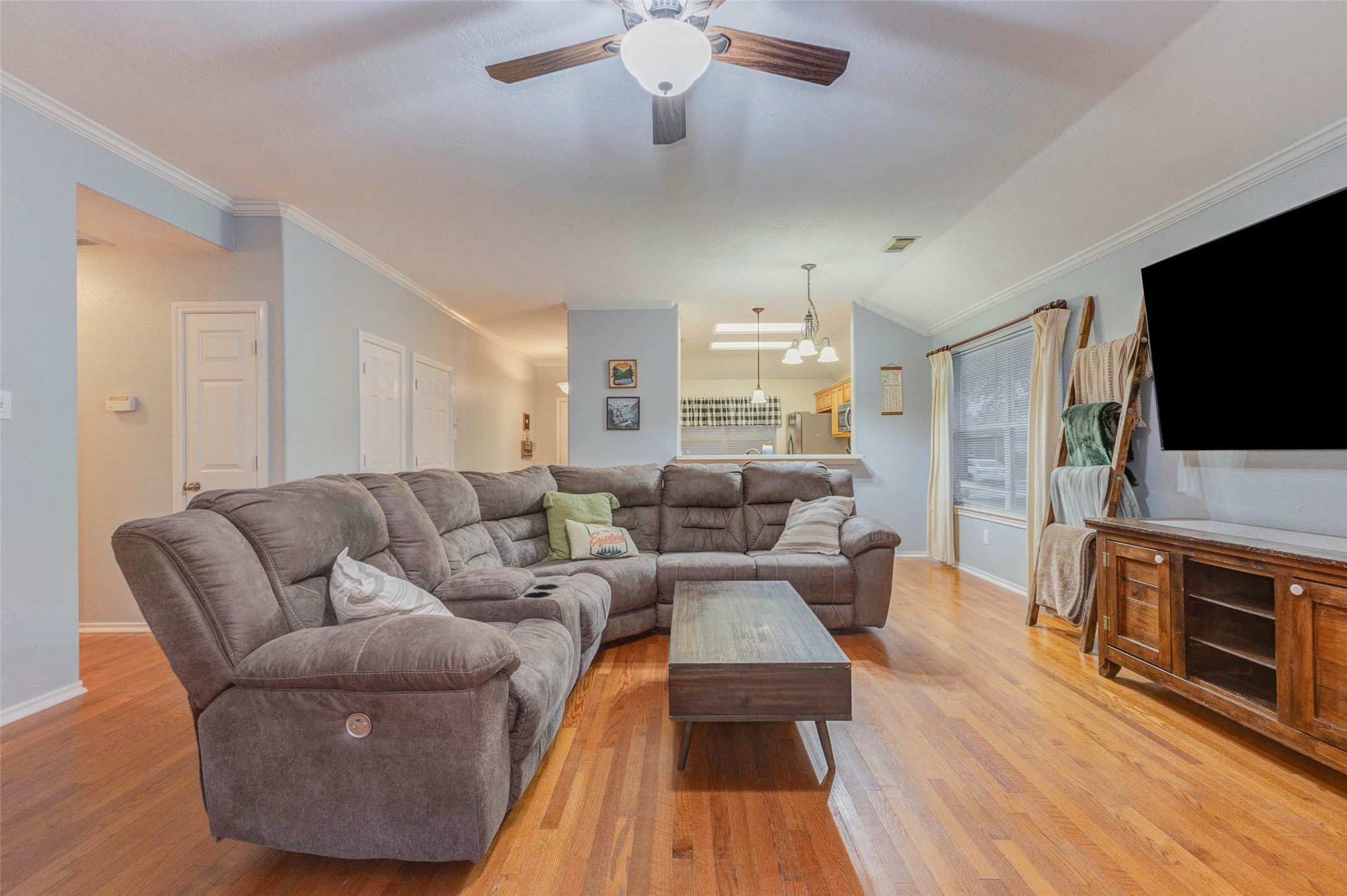 2326 Fern Lacy Drive Spring, TX 77388 - Photo 11 of 31 Generous main living area with entertainment wall, abundant natural light, and inviting layout.