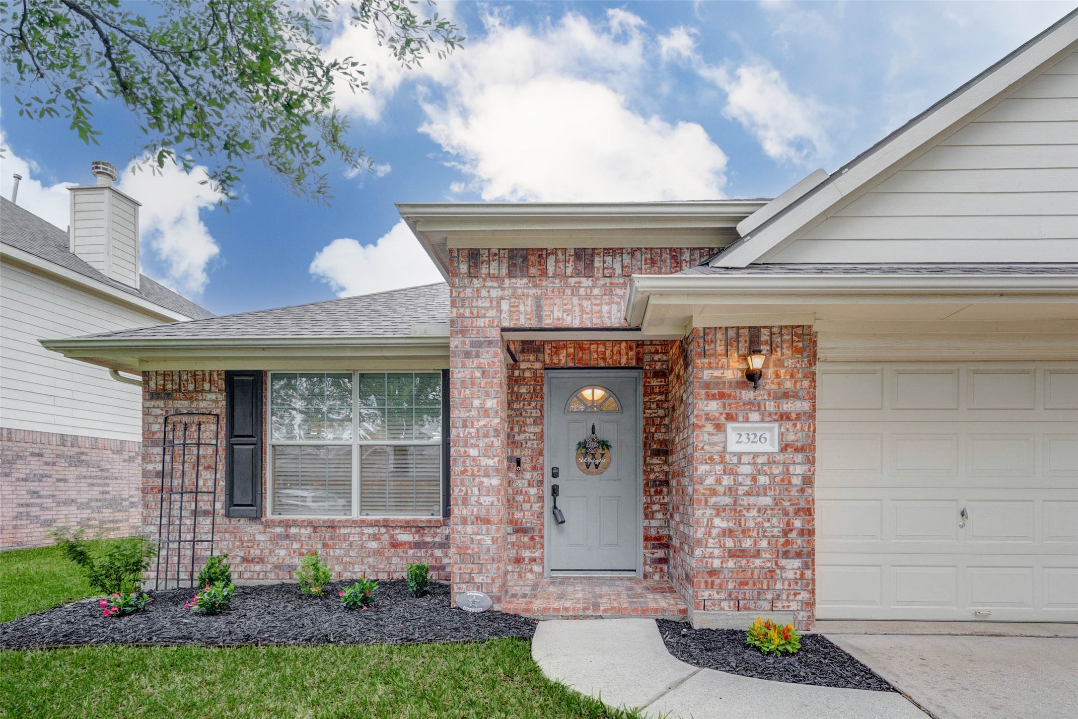 2326 Fern Lacy Drive Spring, TX 77388 - Photo 5 of 31 Covered front entry with fresh landscaping and inviting arrival.