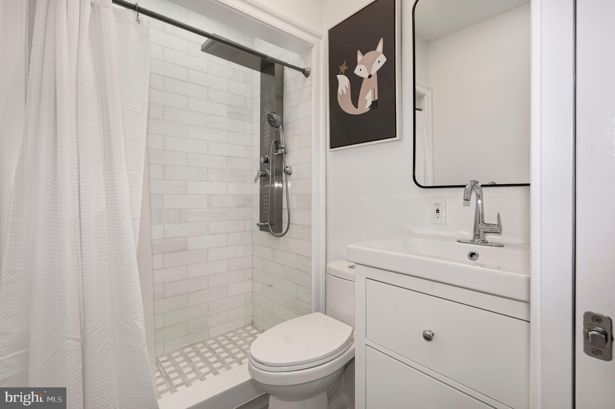 729 Kenyon Street Northwest Washington, DC 20010 - Photo 11 of 26 Chic bathroom with modern finishes.