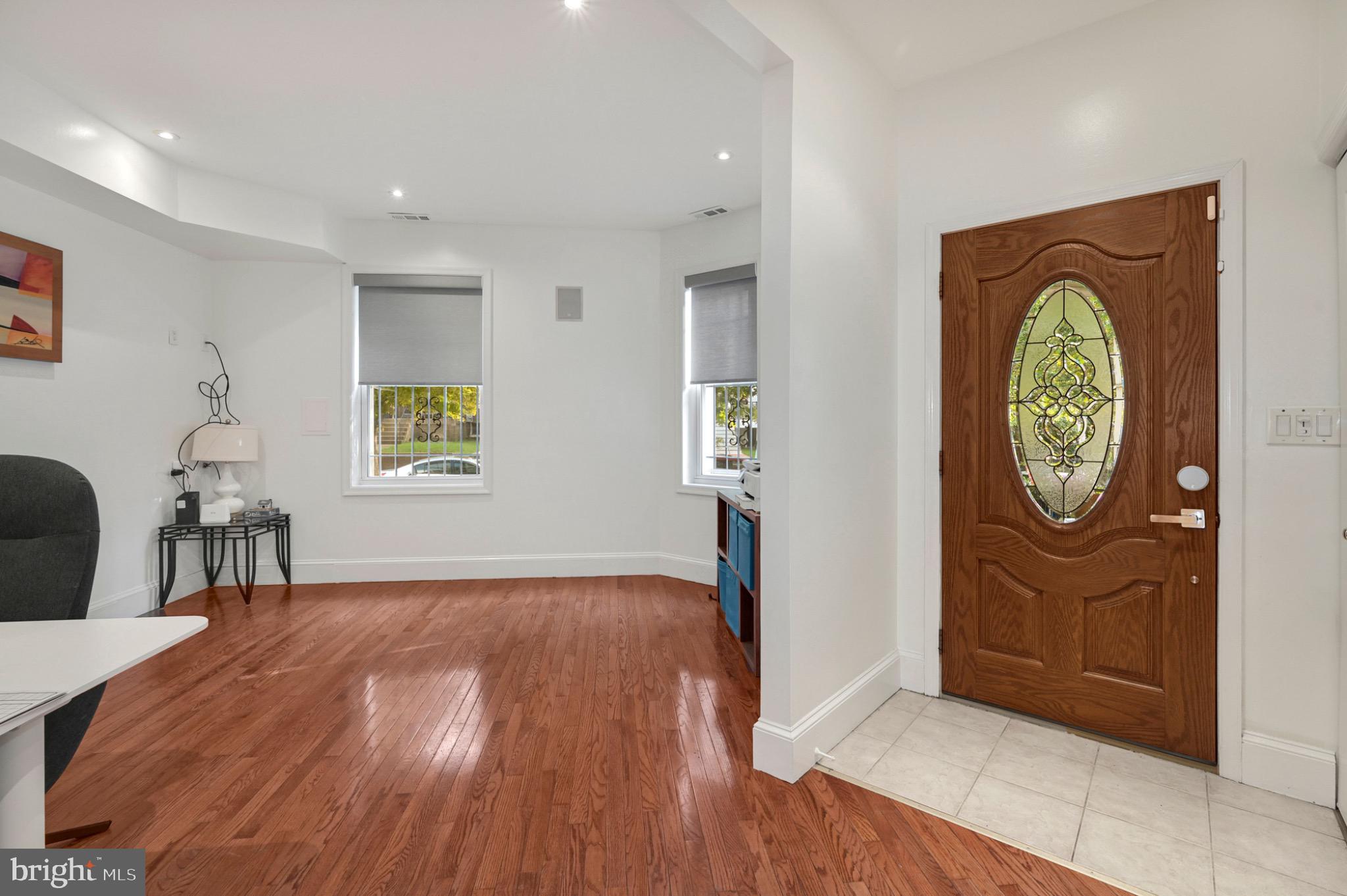 729 Kenyon Street Northwest Washington, DC 20010 - Photo 12 of 26 Inviting entryway with warm wooden floors.(Unit A)