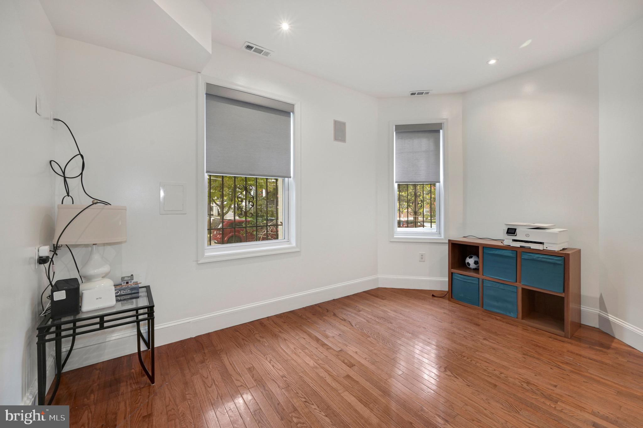 729 Kenyon Street Northwest Washington, DC 20010 - Photo 13 of 26 Bright and airy versatile living room. Unit A