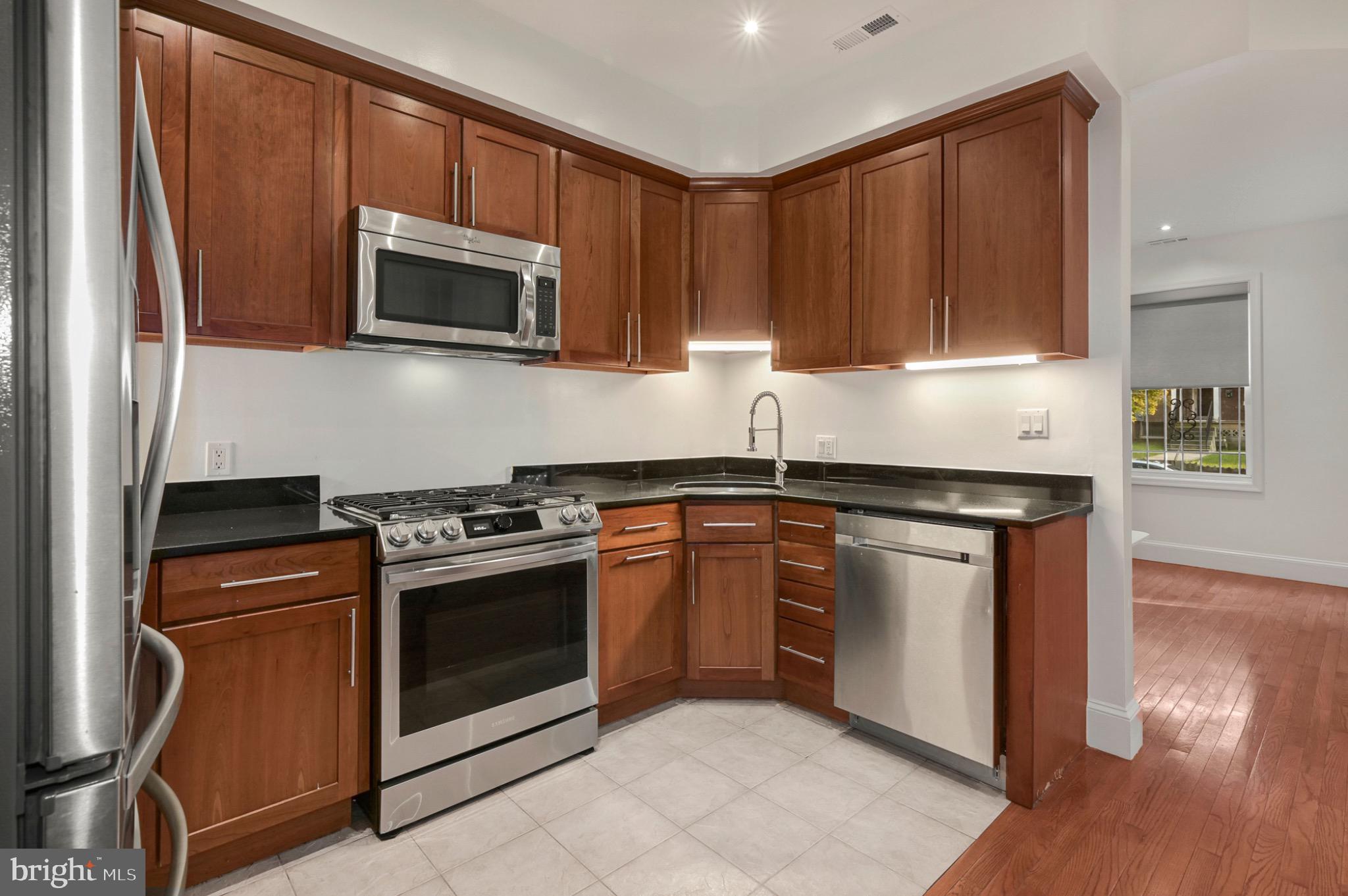 729 Kenyon Street Northwest Washington, DC 20010 - Photo 15 of 26 Modern kitchen with sleek finishes.(Unit A)