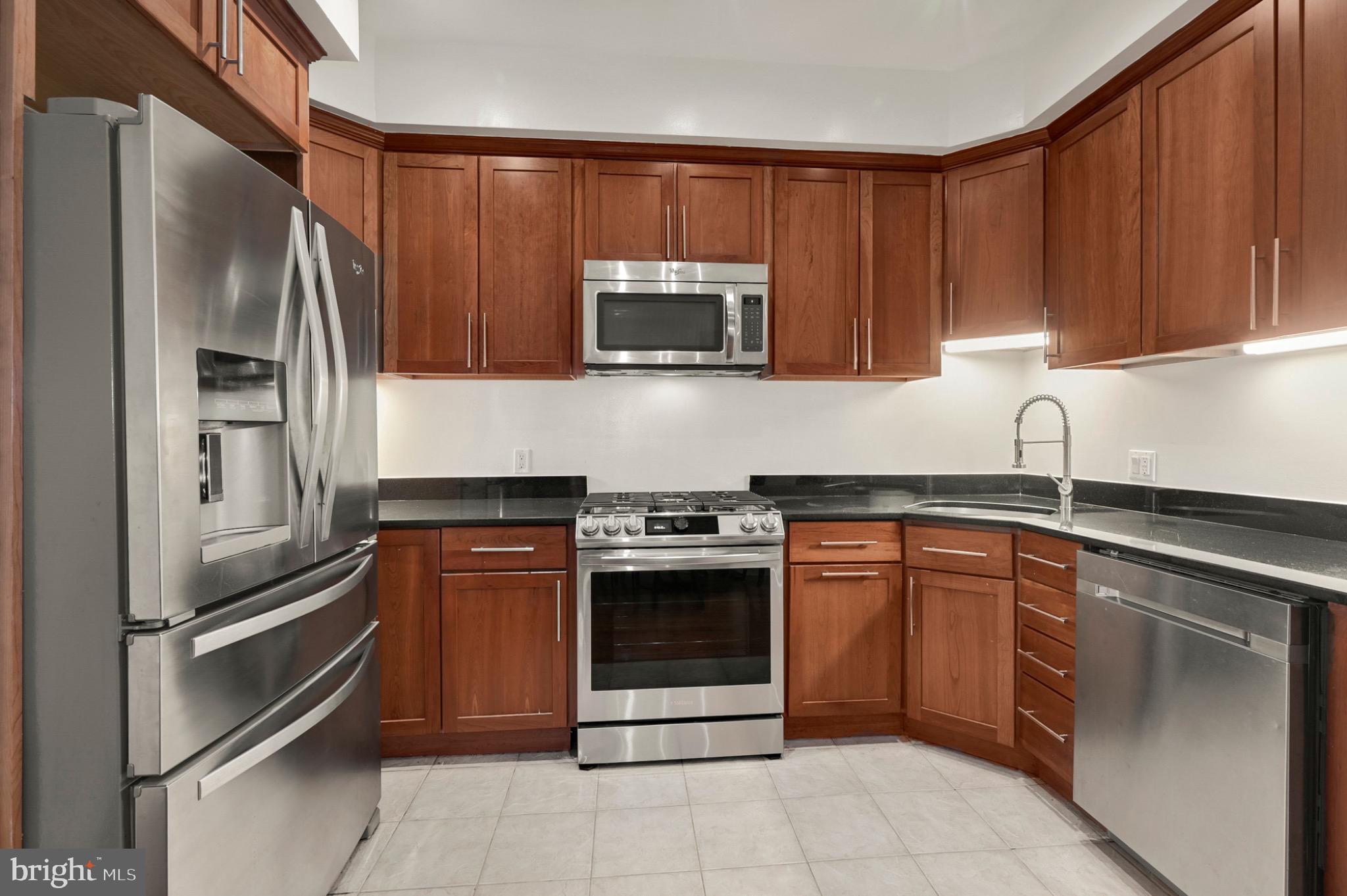 729 Kenyon Street Northwest Washington, DC 20010 - Photo 16 of 26 Sleek kitchen with modern finishes.(Unit A)
